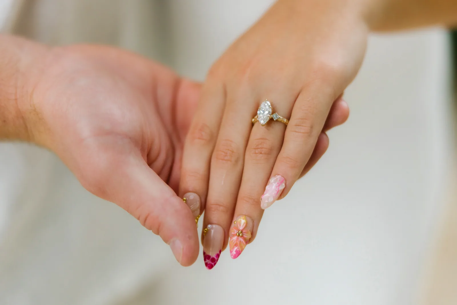 A soft close frame of the engagement ring on her hand